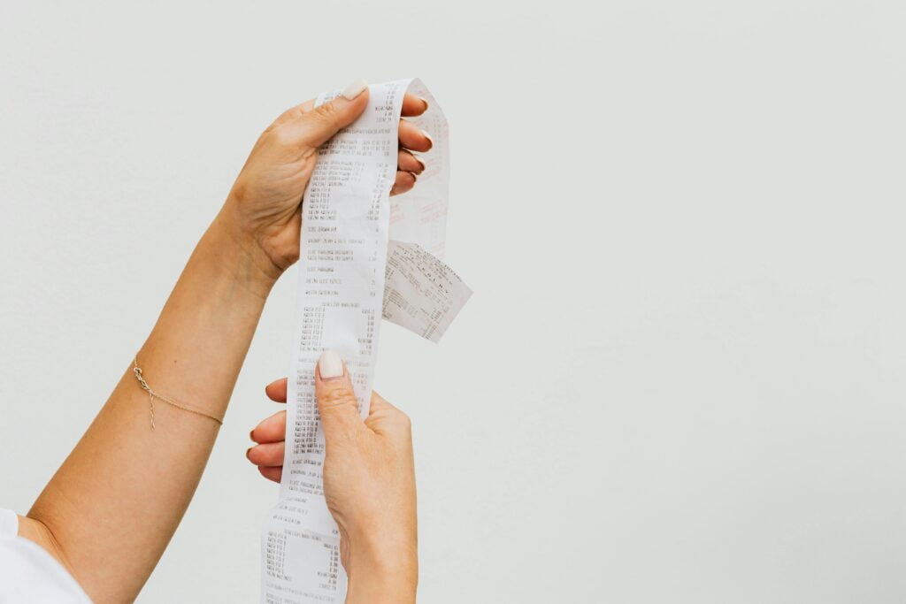 pexels-photo-4959907-4959907 Woman Holding a Receipt